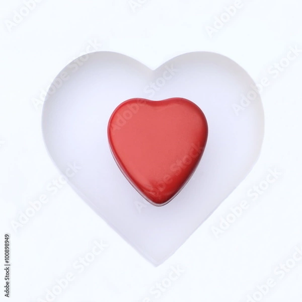 Fototapeta Two heart shaped objects isolated on white background