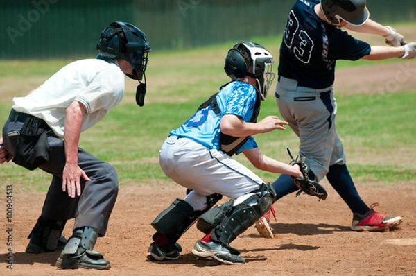 Obraz High school baseball catcher with referee during game.