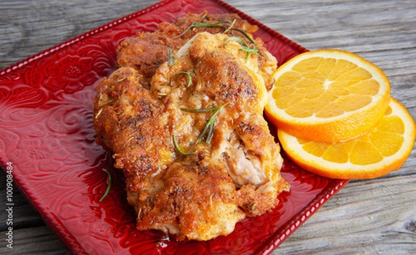 Obraz Grilled chicken on a red plate