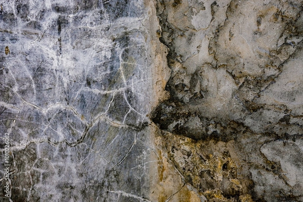 Obraz Abstract texture of a weathered wall with cracks, stains, and natural erosion patterns, ideal for backgrounds, grunge effects, or artistic designs