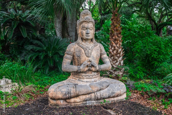 Fototapeta The Buddha statue at the zoo stands as a symbol of peace, offering calm in the midst of the wild, Audubon Zoo, New Orleans, Louisiana, United States of America