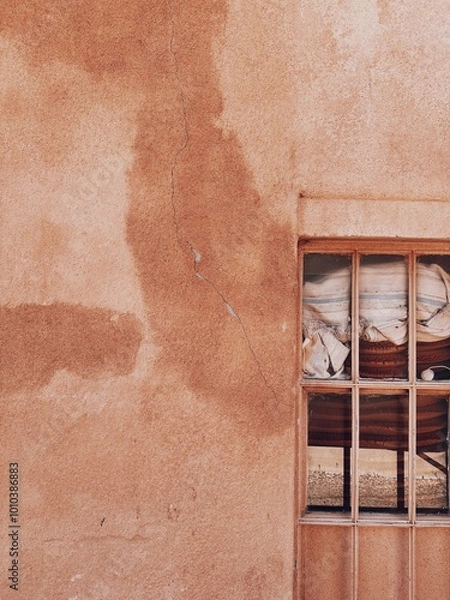 Obraz Paned window in adobe building