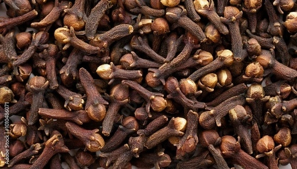 Fototapeta Cloves background, creating a rich and textured surface.