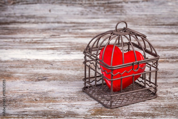 Obraz Valentine's day background with heart in cage