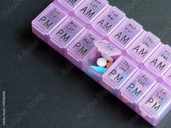 Obraz Pill box storage container for daily organizing of medication.