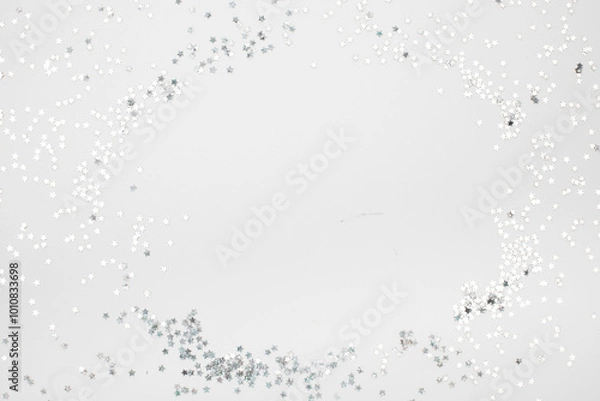 Fototapeta sparkles silver stars on white background with text place- Image