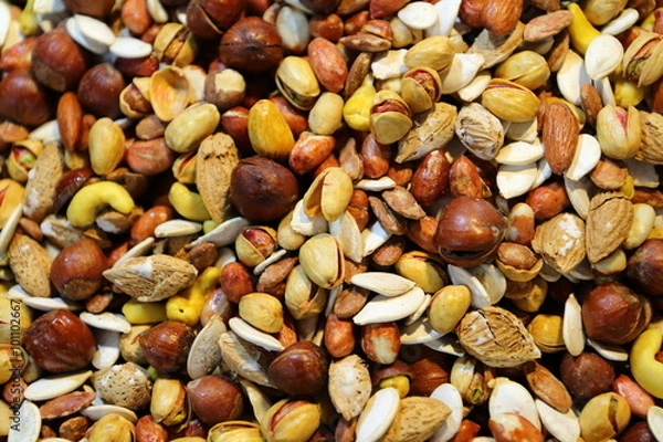 Fototapeta Dried fruit background: nuts, cashews, pistachios and almonds