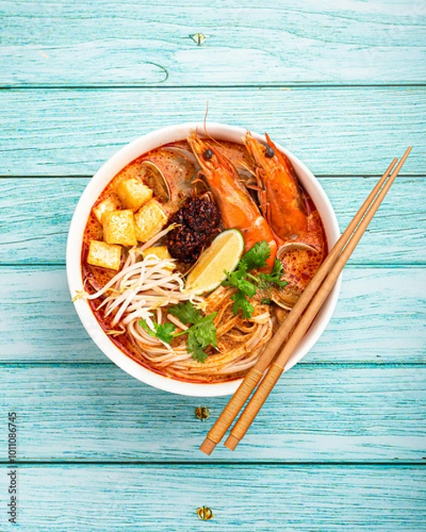 Fototapeta Laksa, Malaysian noodle soup with shrimp, tofu and sprouts, top view