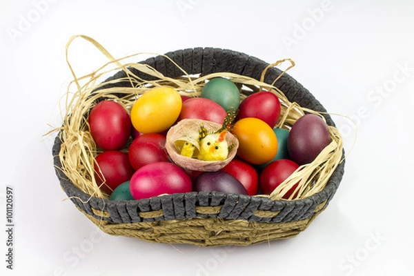 Obraz Colorfull easter eggs in a basket isolated on white