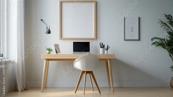 Fototapeta Minimalist home office setup with a wooden desk, plant, and blank wall frame.