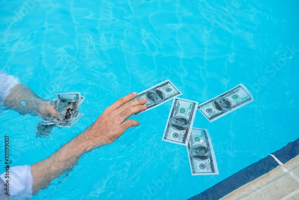 Fototapeta Catching wet banknotes