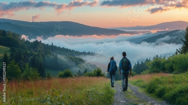 Obraz Two hikers enjoy the view from a mountaintop. AI.