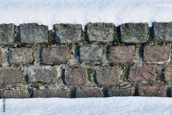 Obraz Ancient stone wall in the snow