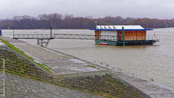 Obraz Restaurant at floating pontoon structure cold winter day river