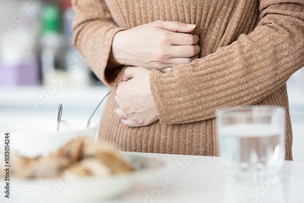 Obraz Sick woman has stomach ache,belly pain,painful in abdomen while eating,inflammation of stomach and intestines,gastrointestinal problems,Gastroenteritis,Dyspepsia,Gallstones,Inflammatory Bowel Disease