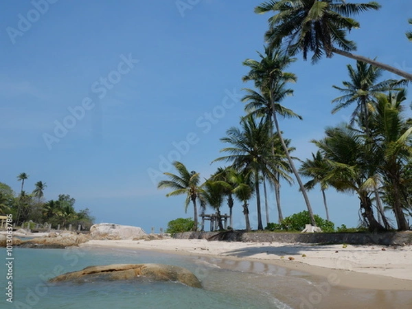 Obraz The beach is a breathtaking sight, with soft, powdery white sand stretching as far as the eye can see. The water is a mesmerizing shade of clear blue, sparkling under the bright sun, inviting you to