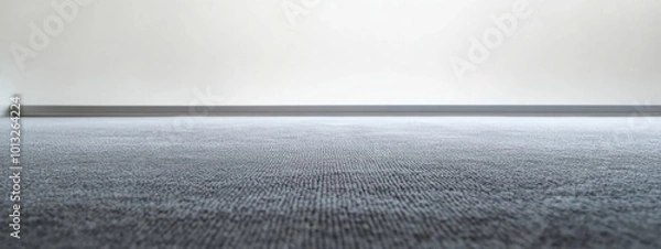 Fototapeta minimalist grey carpet with a subtle, fine texture, laid out on a white background