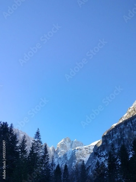 Obraz epic mountain peak with clear sky background