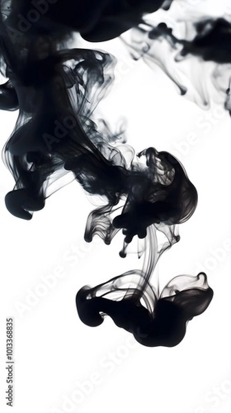 Fototapeta Black ink in water, creating an abstract background with smoke-like shapes on a white background