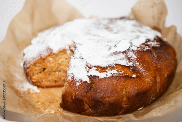 Fototapeta Sweet bread sprinkled with powdered sugar, pie background
