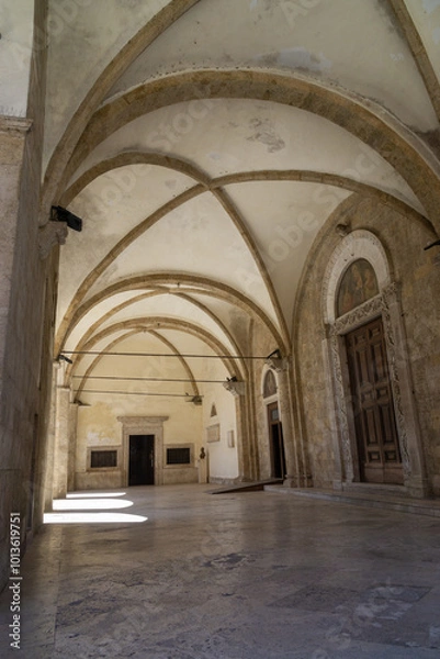 Fototapeta The portico with the access portals to the Cathedral of Santa Maria Assunta, Rieti, Italy