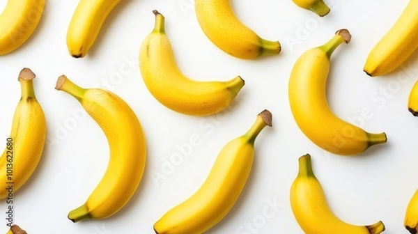Obraz A pattern of ripe yellow bananas on a white background.