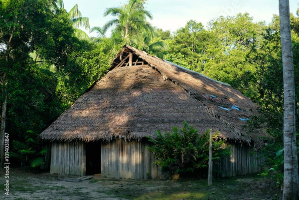 Obraz indigenous traditional maloca house in the amazon forest