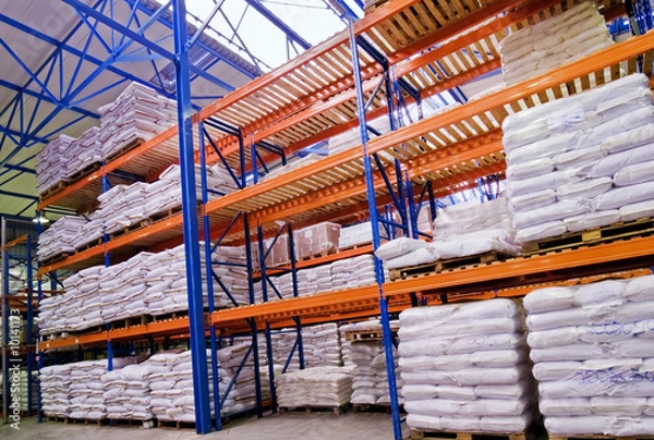 Obraz shelves stacked with goods in warehouse