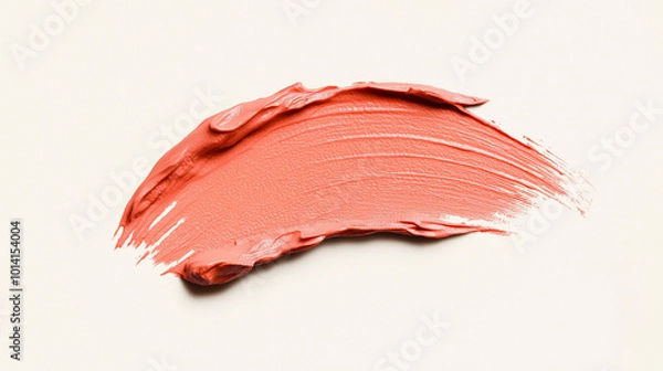 Fototapeta a single, elegant swatch of milky peach lipstick on white background, with soft color gradients and subtle sheen to highlight the texture and glossiness of lip makeup