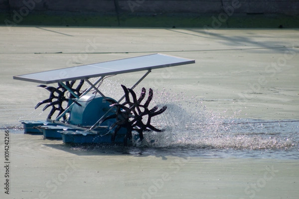 Fototapeta Wastewater treatment using water turbine powered by solar panel