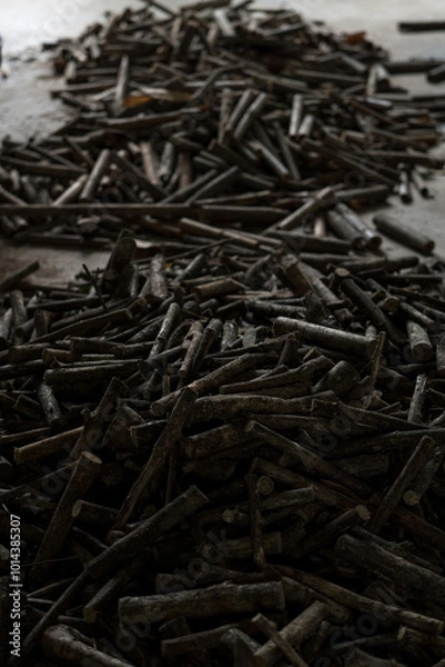Fototapeta Pile of wood preparing for firewood in vertical