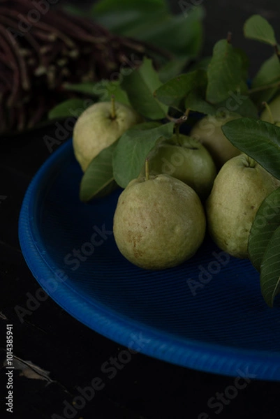 Obraz Guava on blue plate in vertical framing