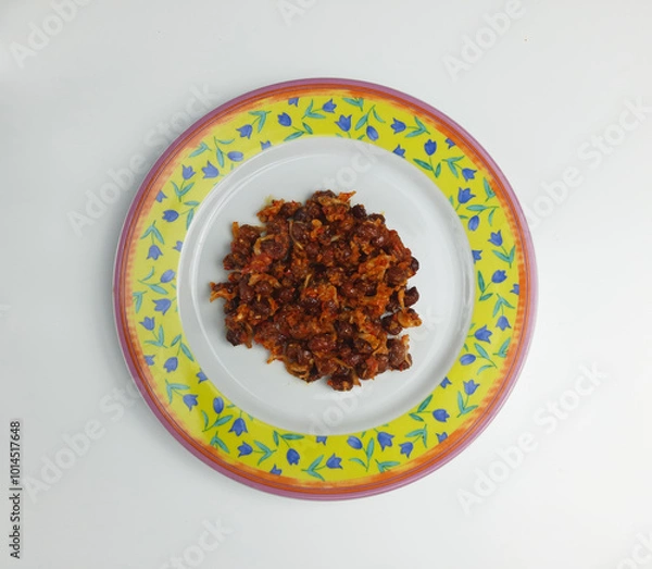 Fototapeta Sambal balado teri kacang is fried anchovy and peanuts with hot and spicy chili sauce. An Indonesian traditional food