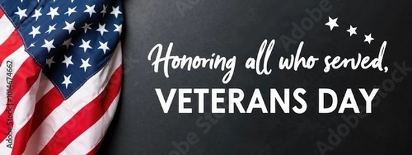 Fototapeta  An American flag draped over a black chalkboard with the text "Honoring all who served... Veterans Day" written in white chalk.