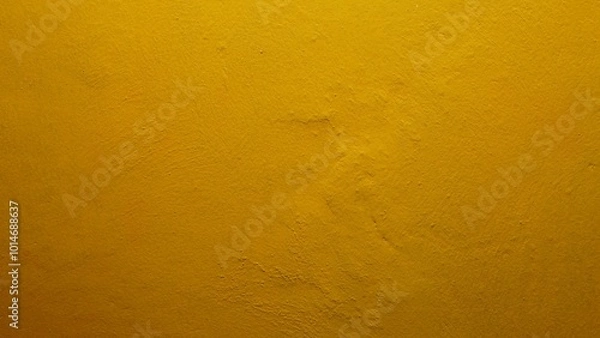 Fototapeta yellow wall texture. The texture background of the wall with yellow paint has a rough surface