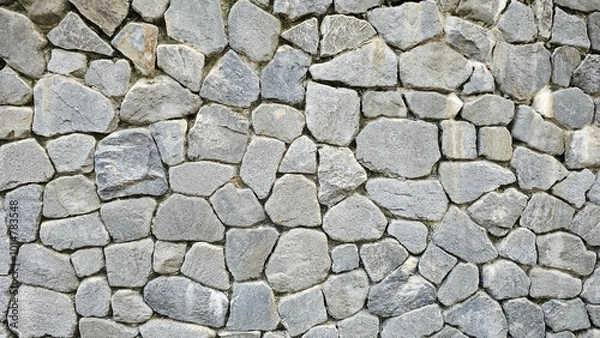 Fototapeta 회색의 돌멩이와 바위로 이루어진 돌담 벽면의 텍스쳐 질감 백그라운드