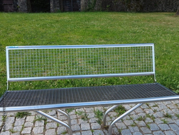 Fototapeta beautiful modern metal bench in the park