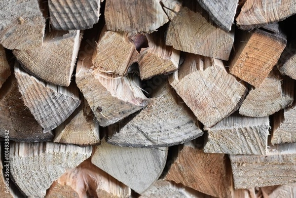 Fototapeta A stack of firewood logs of spruce and fruit tree wood.