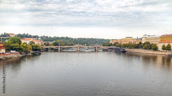 Fototapeta Jiraskuv Most is a road arch bridge across the Vltava River in Prague, Czech Republic