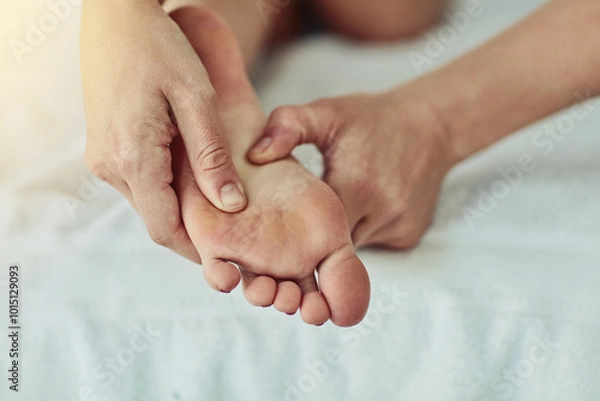 Fototapeta Foot massage, hands and relax with person in spa closeup for break, luxury treatment or wellness. Beauty, pedicure or skincare with customer and professional masseuse in resort for calm or quiet