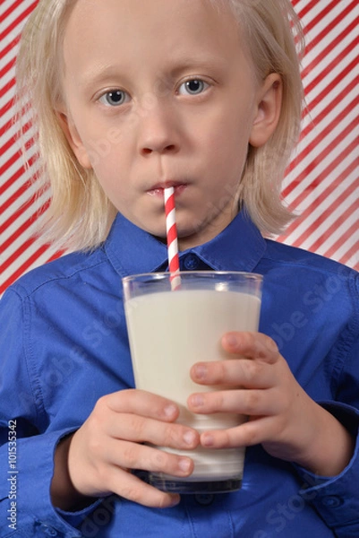 Fototapeta boy drinking milk with a straw