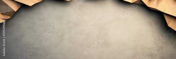 Fototapeta Abstract geometric background with brown paper shapes on a textured, gray backdrop.