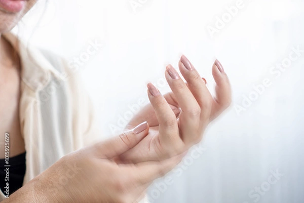 Fototapeta woman suffering from numbness and tingling in hands and fingers
