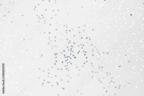 Fototapeta sparkles silver stars on white background with text place- Image