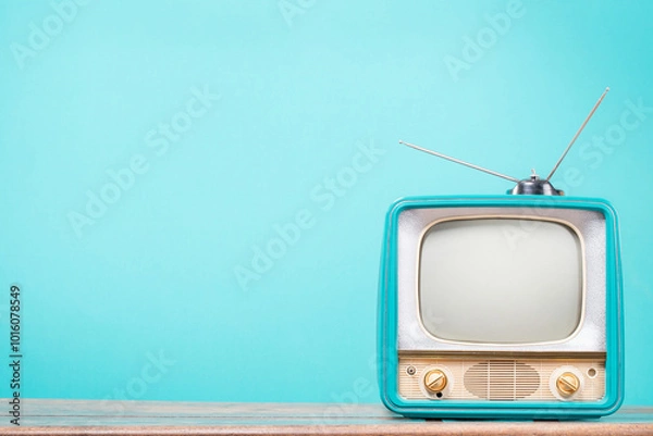 Obraz Retro CRT TV with antenna on old table front gradient mint blue background. Vintage style filtered photo