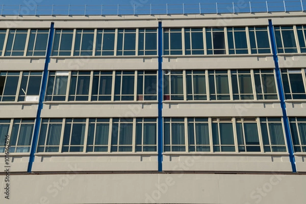Fototapeta detail of facade modular windows of a modern university building, designed with linear glass, for efficient working comfort. The energy class today is one of the most evaluated and studied standards.