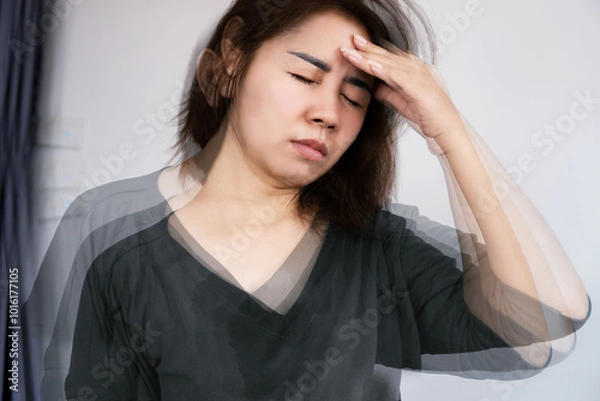 Obraz Asian woman suffering from Anemia feeling dizzy and vertigo , weakness and shortness of breath