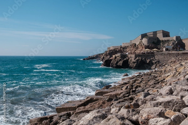 Obraz Waves crushing against cliff of city of Sete, France