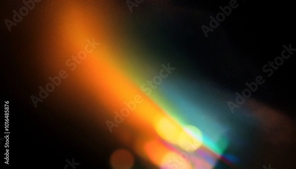 Fototapeta Grainy colorful warm rainbow light leaks on black background with dust texture. Defocused abstract damaged scratched retro film analog effect for using over photos as overlay or screen filter