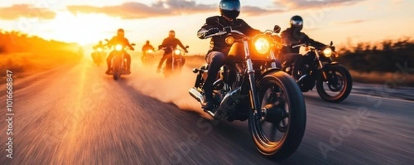 Fototapeta Dynamic motorcycle ride at sunset, showcasing speed and freedom on an open road with multiple riders in action.